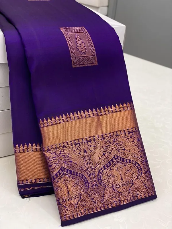 Blue_Kanjivaram_Silk_Saree_with_Copper_Zari_Peacock_Motifs_and_Temple_Border