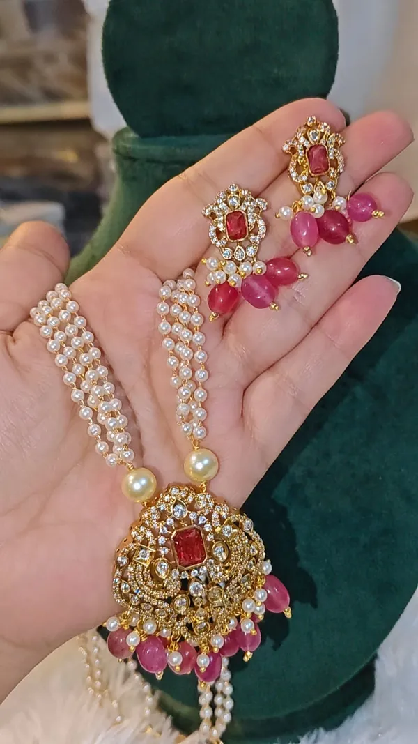 AAROHI_NECKLACE_-_BEAUTIFUL_PEARL_MALA_WITH_AD_STONE_PENDANT_IN_RUBY_PINK