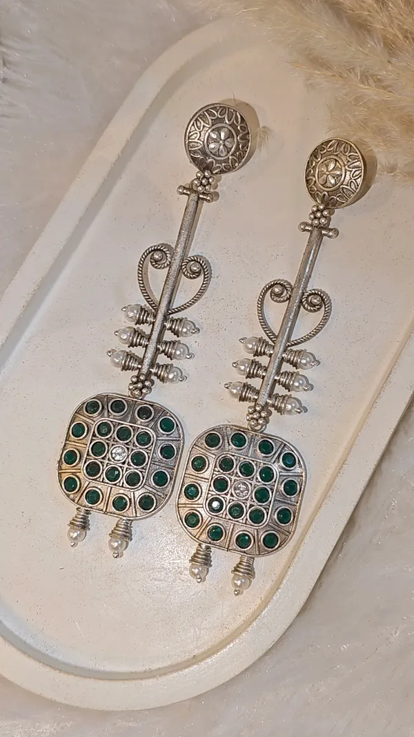 ANTIQUE_SILVER_LONG_DANGLER_EARRINGS_WITH_GREEN_STONE_WORK
