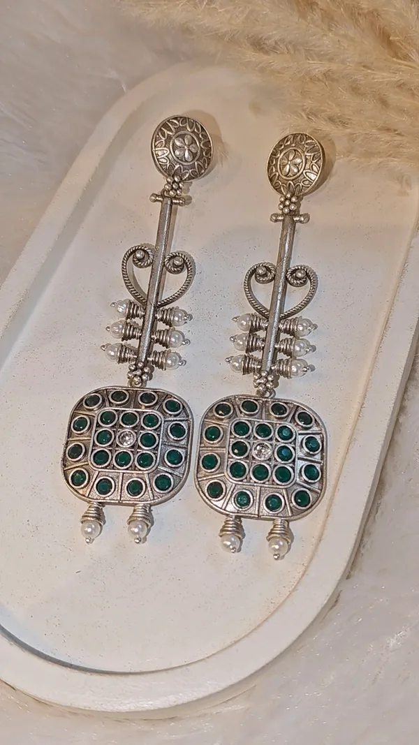 ANTIQUE_SILVER_LONG_DANGLER_EARRINGS_WITH_GREEN_STONE_WORK