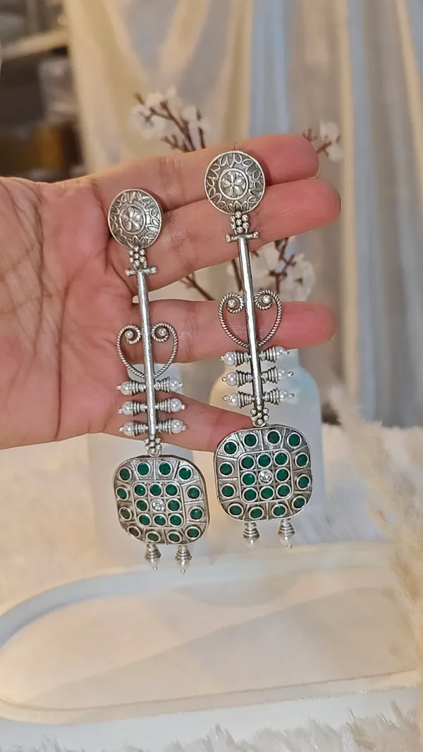 ANTIQUE_SILVER_LONG_DANGLER_EARRINGS_WITH_GREEN_STONE_WORK