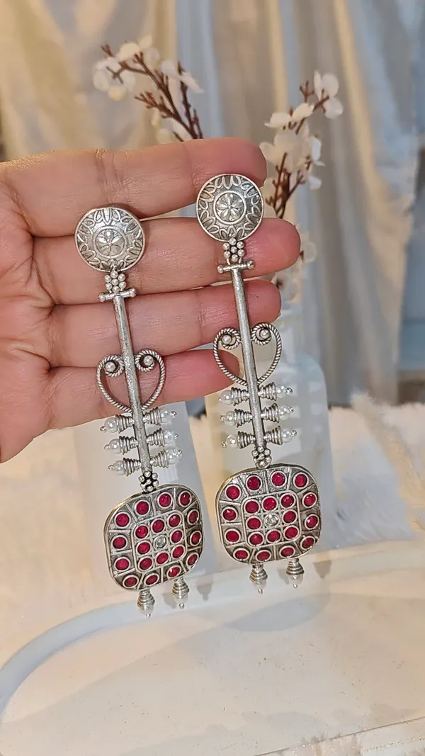 ANTIQUE_SILVER_LONG_DANGLER_EARRINGS_WITH_RED_STONE_WORK