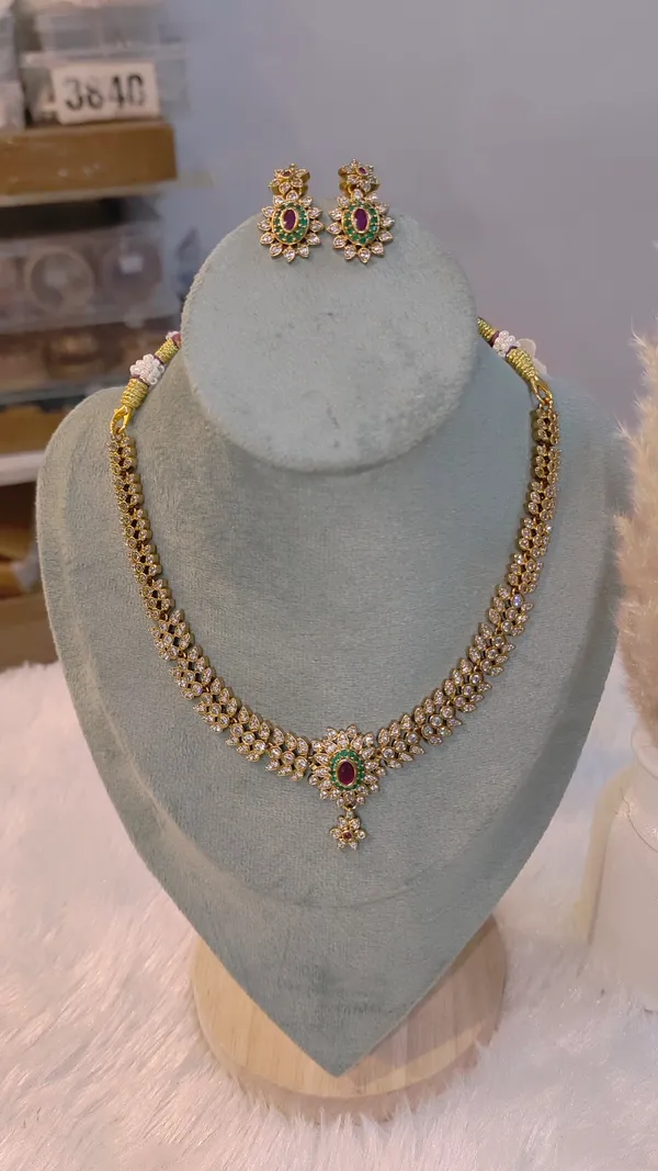 CLASSIC_PARVATHI_GOLD-PLATED_NECKLACE_SET_WITH_RUBY_&_EMERALD_ACCENTS