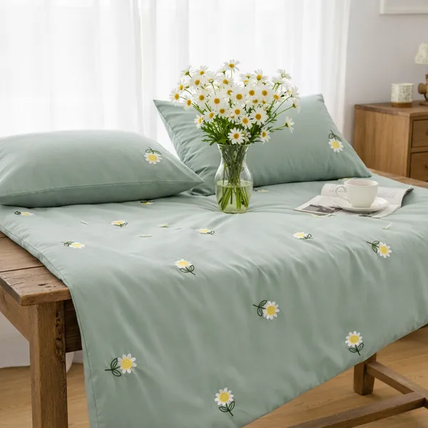 Exquisite_embroidered_bedsheet_with_white_daisy_floral_pattern_on_green_in_premium_cotton_bedsheet_along_with_two_pillow_covers