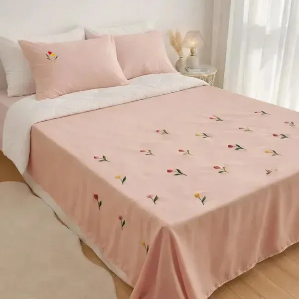 Exquisite_embroidered_bedsheet_with_multicolour_tulips_on_peach_in_premium_cotton_bedsheet_along_with_two_pillow_covers