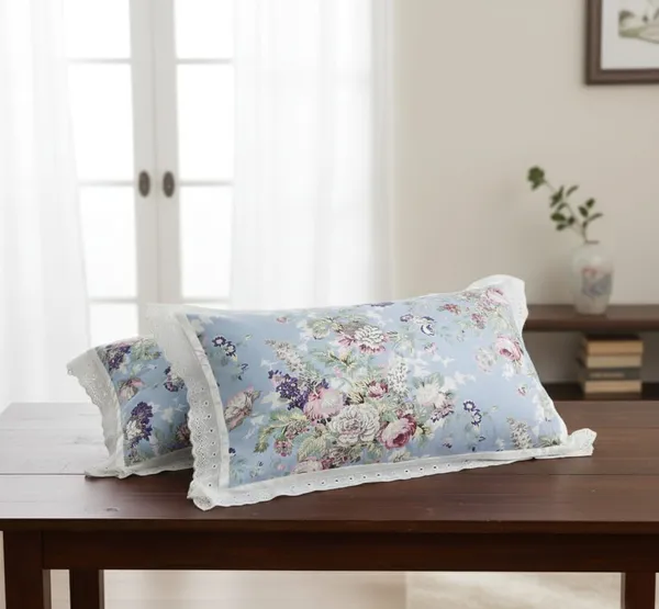 Exquisite_floral_bloom_on_light_blue_on_premium_cotton_bedsheet_and_two_pillow_covers_decorated_with_double_lace