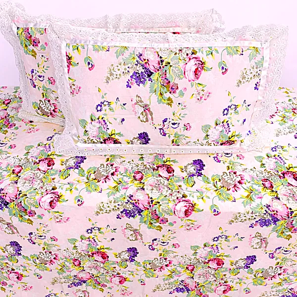 Exquisite_floral_bloom_on_light_pink_on_premium_cotton_bedsheet_and_two_pillow_covers_decorated_with_double_lace