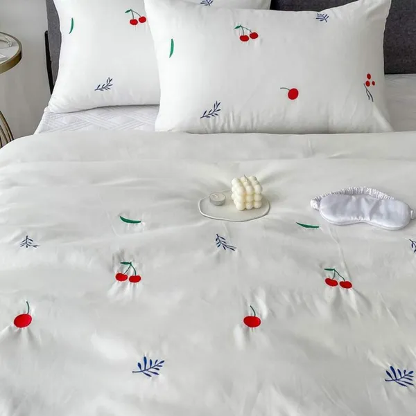 Exquisite_embroidered_cotton_bedsheet_with_red_cherry_and_green-blue_leaf_pattern_on_white_in_premium_cotton_bedsheet_and_two_pillow_covers
