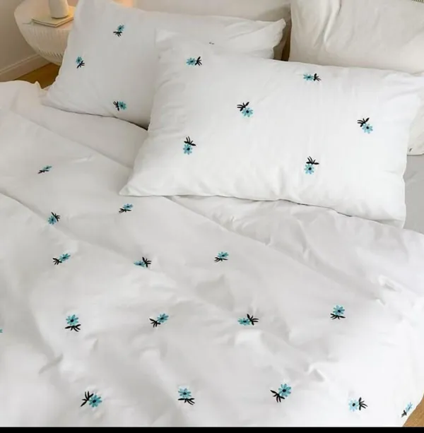 Exquisite_embroidered_bedsheet_with_blue_floral_pattern_on_white_in_premium_cotton_bedsheet_along_with_two_pillow_covers