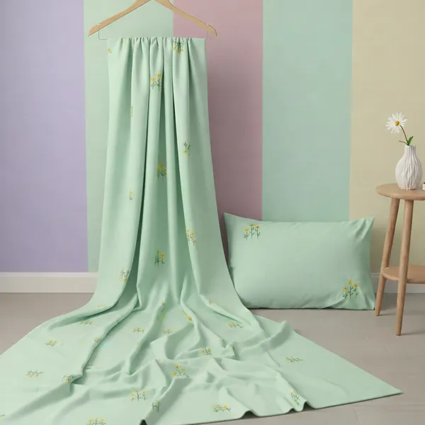 Exquisite_embroidered_bedsheet_in_triple_flower_pattern_in_yellow_on_green_premium_cotton_bedsheet_with_two_pillow_covers