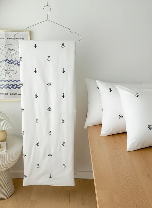 Exquisite_embroidered_bedsheet_with_grey_anchor_and_ship_wheel_pattern_on_white_in_premium_cotton_bedsheet_with_two_pillow_covers