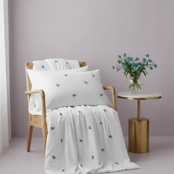 Exquisite_embroidered_bedsheet_with_blue_floral_pattern_on_white_in_premium_cotton_bedsheet_along_with_two_pillow_covers