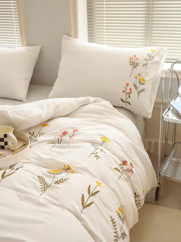 Exquisite_embroidered_bedsheet_in_orange,_yellow_and_green_floral_pattern_on_ivory_premium_cotton_bedsheet_with_two_pillow_covers