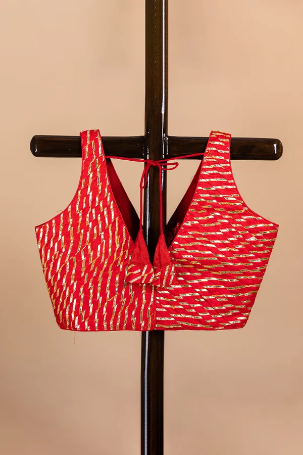 Red_Blouse_With_V_Neck_And_Golden_Zari_Work