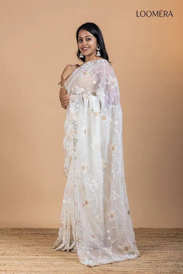 White_Organza_Saree_With_Heavy_Thread_Work_And_Stone_Embellishments