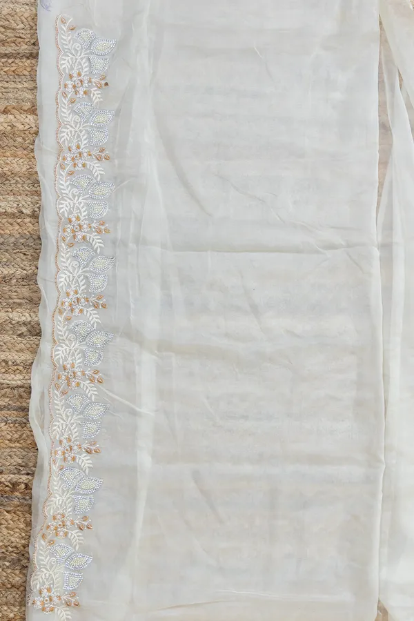 White_Organza_Saree_With_Heavy_Thread_Work_And_Stone_Embellishments