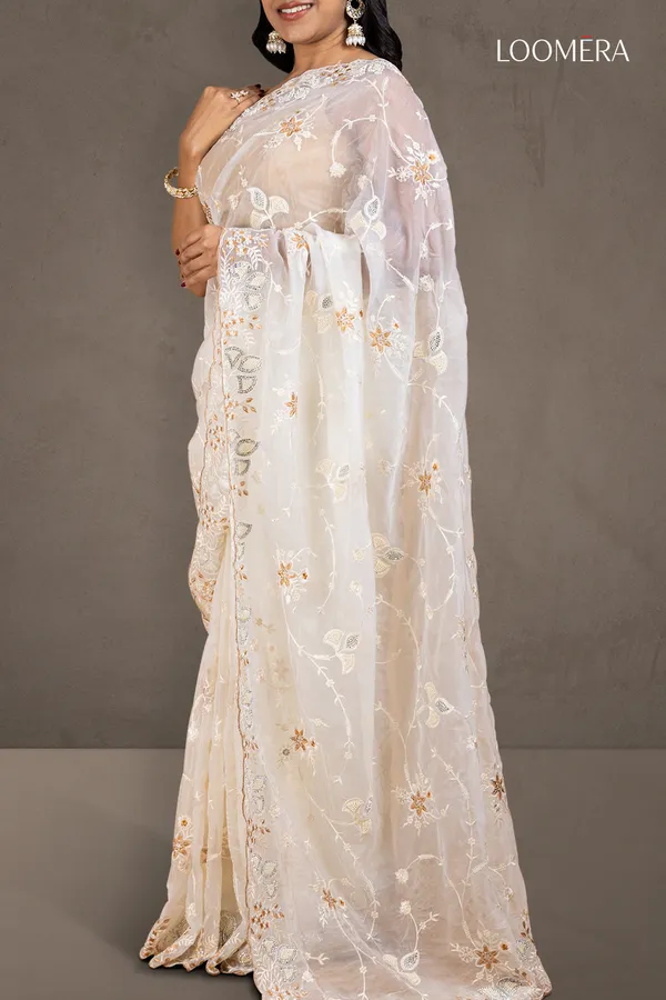 White_Organza_Saree_With_Heavy_Thread_Work_And_Stone_Embellishments
