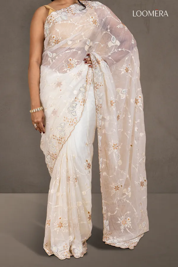 White_Organza_Saree_With_Heavy_Thread_Work_And_Stone_Embellishments