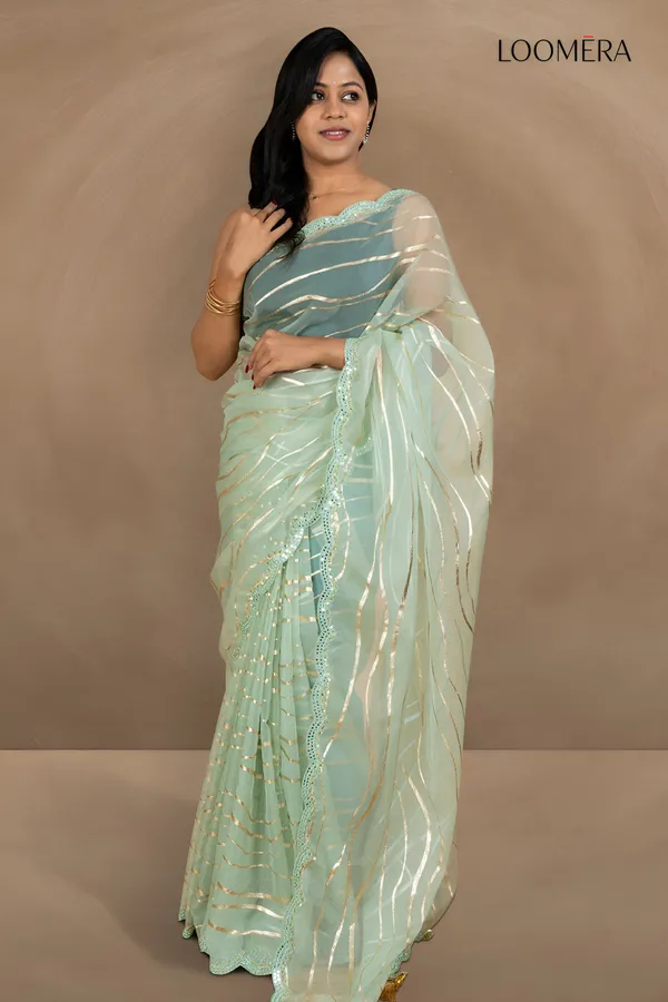 Pastel_Green_Organza_Saree_With_Mirror_Scallop_Border