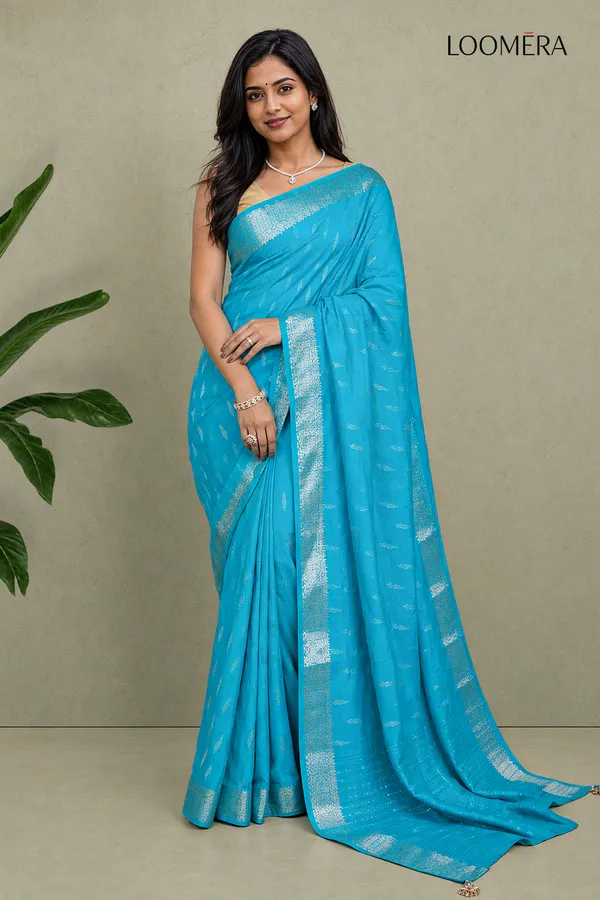 Cyan_Blue_Semi_Silk_Saree_With_Silver_Butta_And_Zari_Border