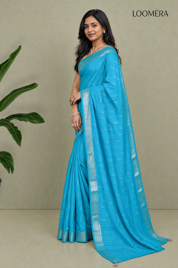 Cyan_Blue_Semi_Silk_Saree_With_Silver_Butta_And_Zari_Border