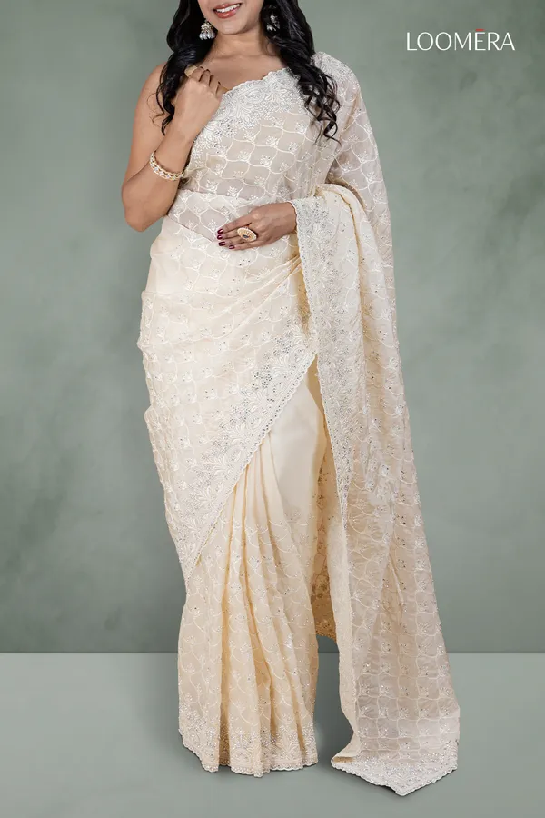 Off_White_Organza_Saree_With_Heavy_Thread_And_Stone_Embellishments