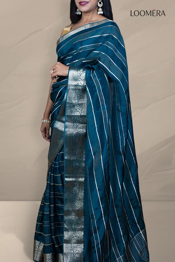 Prussian_Blue_Saree_With_Silver_Zari_Lines_And_Floral_Zari_Border