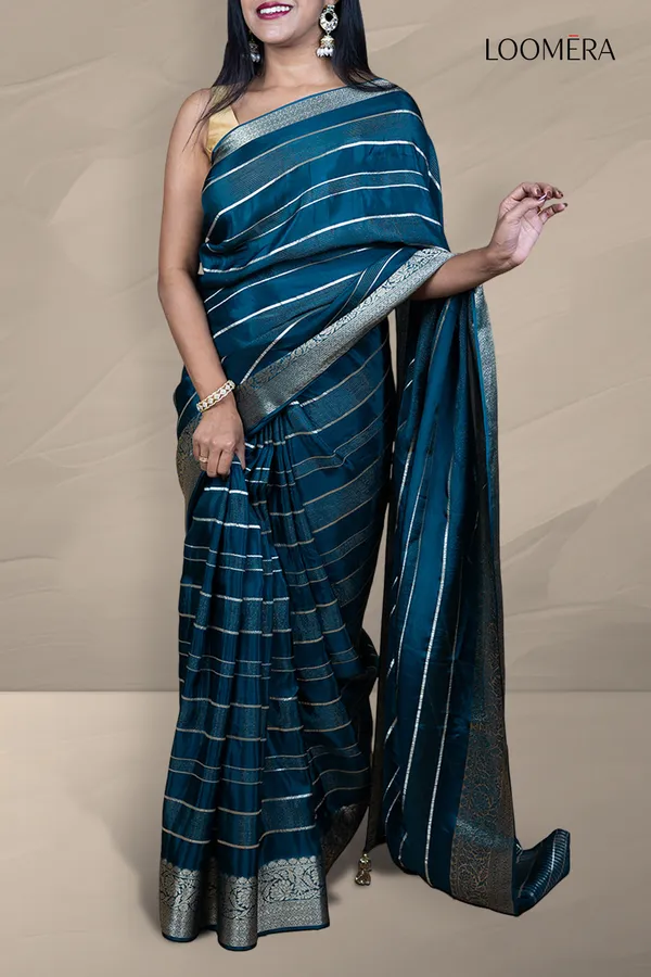 Prussian_Blue_Saree_With_Silver_Zari_Lines_And_Floral_Zari_Border