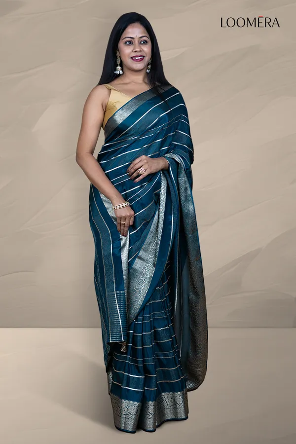 Prussian_Blue_Saree_With_Silver_Zari_Lines_And_Floral_Zari_Border