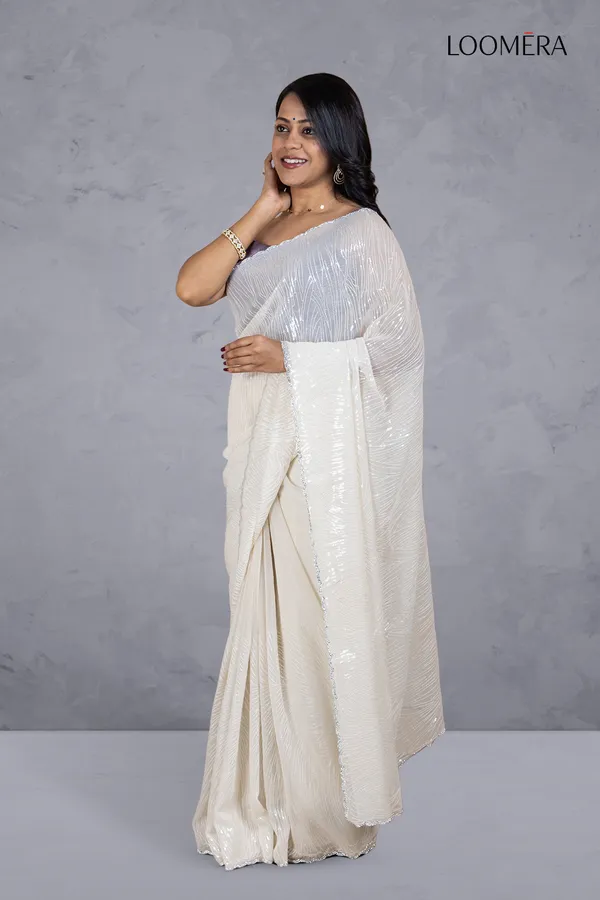 Off_White_Shimmer_Chiffon_Saree_With_Sequin_Work_And_Scallop_Border