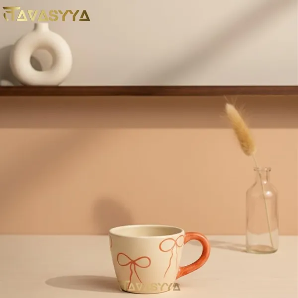 Light_Beige_&_Pink_Handmade_Ceramic_Coffee_Mug_With_Bow_Design_Cute_Tea_Cup_With_Ergonomic_Handle