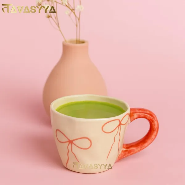 Light_Beige_&_Pink_Handmade_Ceramic_Coffee_Mug_With_Bow_Design_Cute_Tea_Cup_With_Ergonomic_Handle