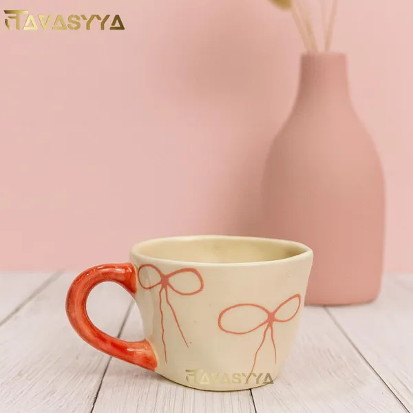 Light_Beige_&_Pink_Handmade_Ceramic_Coffee_Mug_With_Bow_Design_Cute_Tea_Cup_With_Ergonomic_Handle