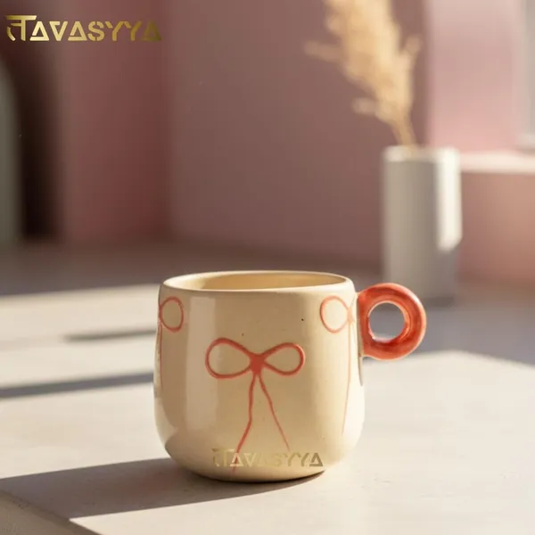 Light_Beige_Handmade_Ceramic_Coffee_&_Tea_Cup_With_Bow_Design_Coffee_Mug_With_Round_Handle