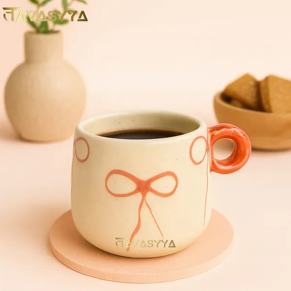 Light_Beige_Handmade_Ceramic_Coffee_&_Tea_Cup_With_Bow_Design_Coffee_Mug_With_Round_Handle