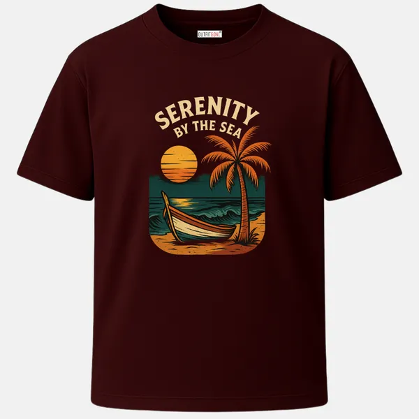 _Regular_Unisex_Maroon_Graphics_T-Shirt,_Sunset_palm_tree_boat_on_shore_text_serenity_by_the_sea_|_TRAVEL_MODE