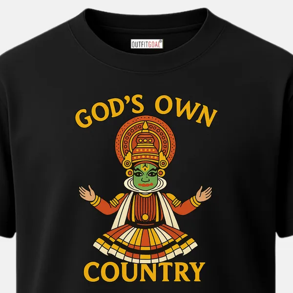 _Regular_Unisex_Black_Graphics_T-Shirt,_Full_Kathakali_dancer_figure_with_extended_arms_and_layered_costume_under_curved_text__GOD’S_OWN_COUNTRY,_bright_folk_art_style_celebrating_Kerala_culture._|_TRAVEL_MODE