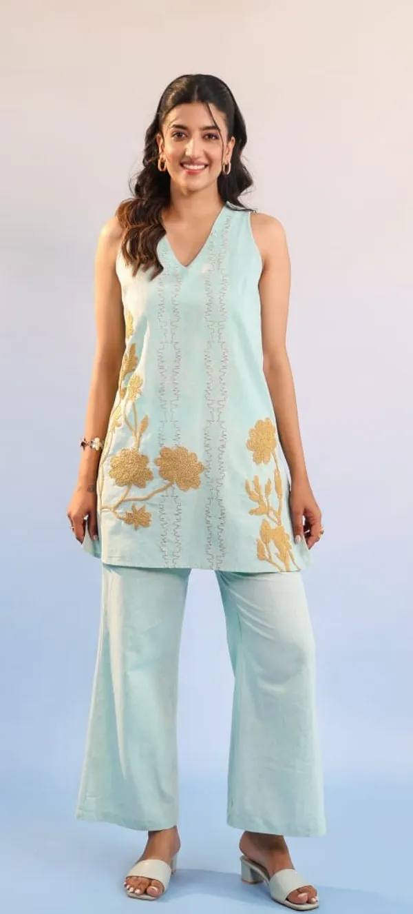 Sage_green_embroidered_cotton_tunic_and_pant_set_with_gold_floral_motifs_and_sleek_thread-line_detailing.
