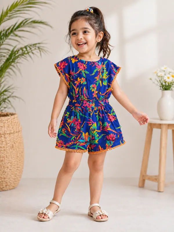 Girls_Printed_Cotton_Playsuit_Blue_Floral_With_Pom-Pom_Trim