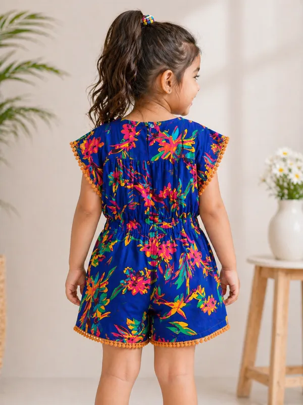 Girls_Printed_Cotton_Playsuit_Blue_Floral_With_Pom-Pom_Trim