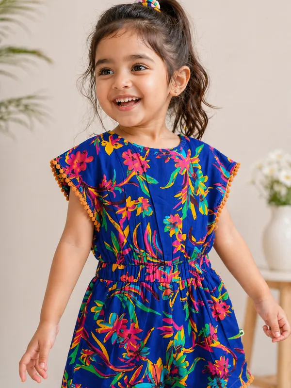 Girls_Printed_Cotton_Playsuit_Blue_Floral_With_Pom-Pom_Trim