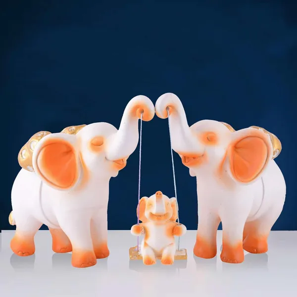 Resin_Set_of_3_Elephent_showpiece_for_Home_Decoration_Items_Table_Dcor_Living_Room_Gift_Boxes_for_Weddings,_Parties,_Housewarming_for_Home_and_Office_Use_(White_Orange)