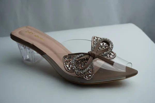 Seraphine_Crystal-Bow_Lucite-Heel_Slide_–_Mocha_Nude