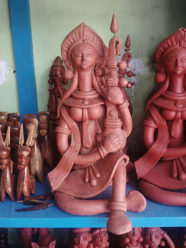 Brownish_Red_Terracotta_Clay_Saraswati_Idol_For_Indoor