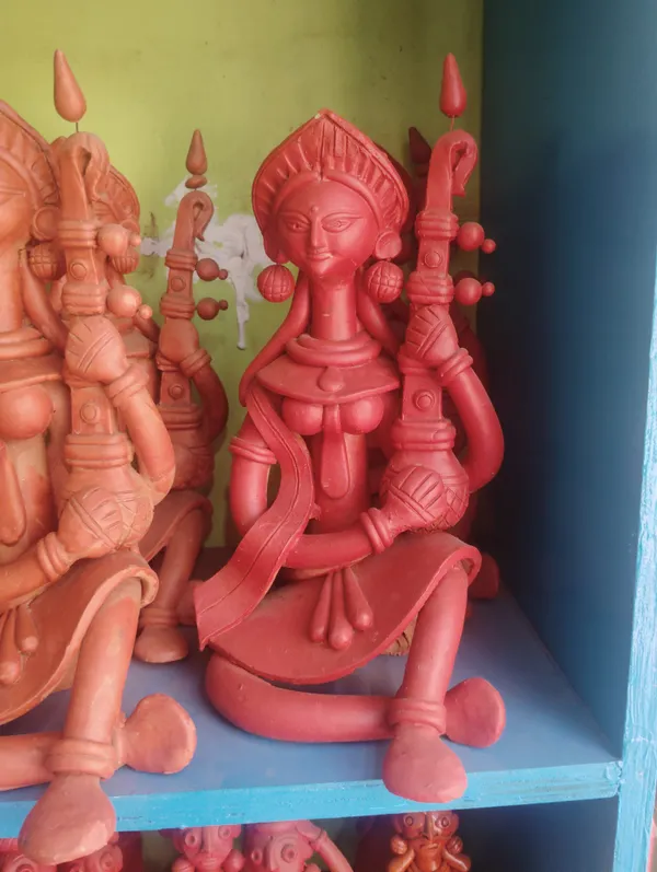 Brownish_Red_Terracotta_Clay_Saraswati_Idol_For_Indoor