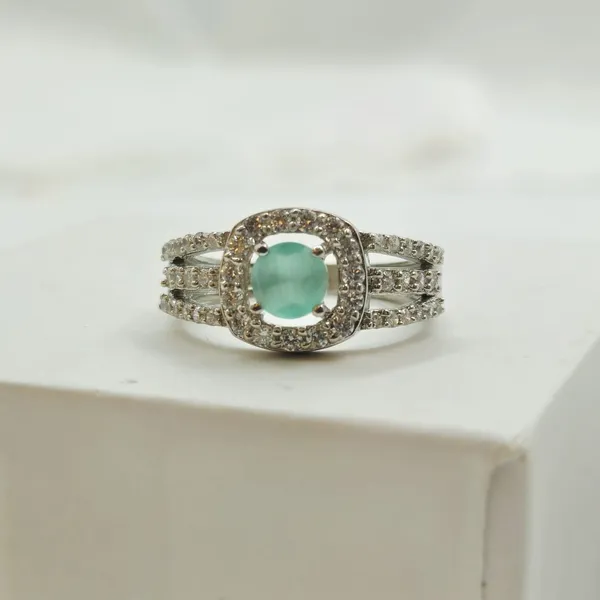 Green_Gemstone_Halo_Ring_With_A_Pave_Split-Shank_Band