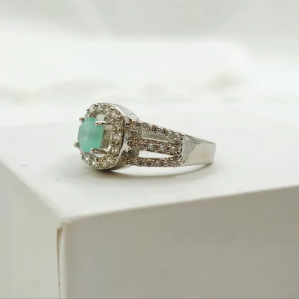 Green_Gemstone_Halo_Ring_With_A_Pave_Split-Shank_Band