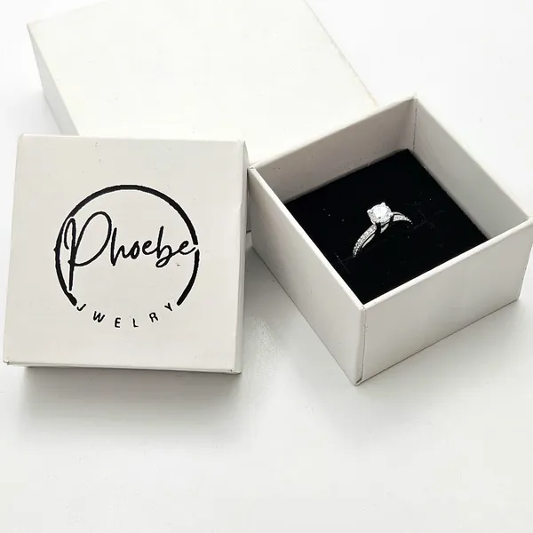 Round-Cut_Solitaire_Engagement_Ring_With_A_Channel-Set_Band