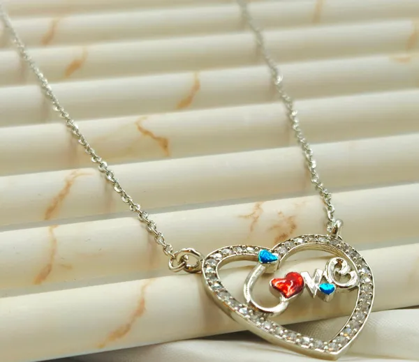 Silver_Pave_Heart_Pendant_With_Enamel_"Love"_Script.