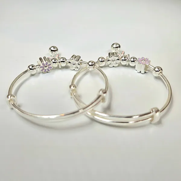 Silver_Baby_Bangles_With_Floral_Charms_And_Jingle_Bell